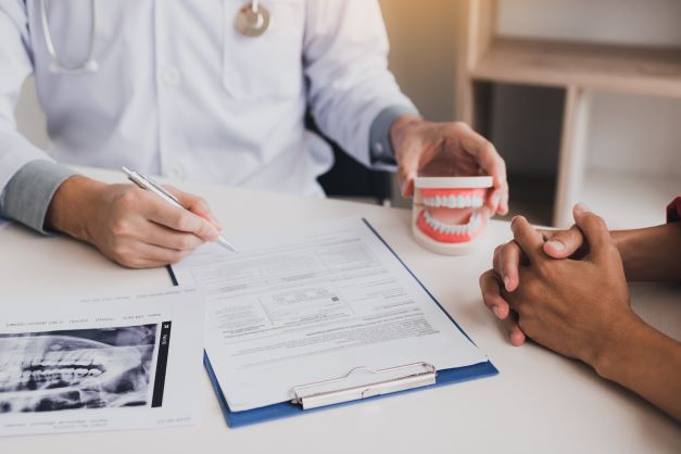 dentist reviewing root canal plan