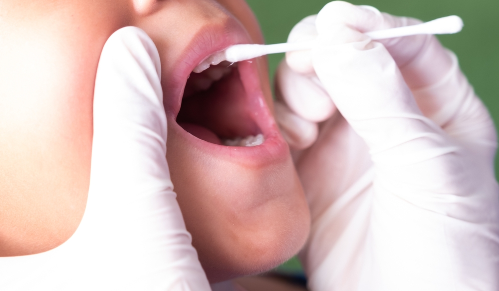 child getting fluoride treatment